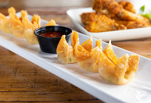 Fried appetizers served with dipping sauce