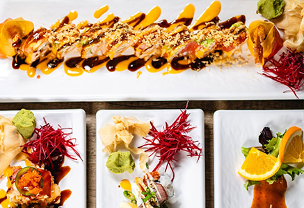 A selection of sushi rolls with colorful garnishes
