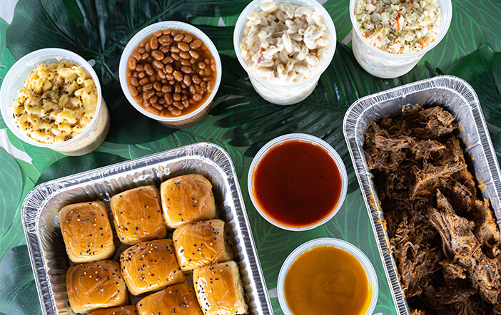 Catering trays and bowls arranged for a meal