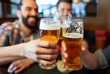 Friends clinking glasses of beer
