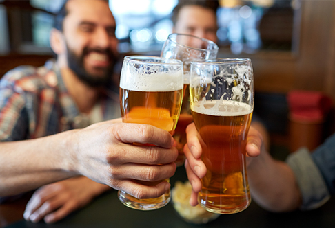 Friends raising glasses of beer